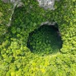 Visit Dark Cave for ziplining, mud baths, and jungle adventures