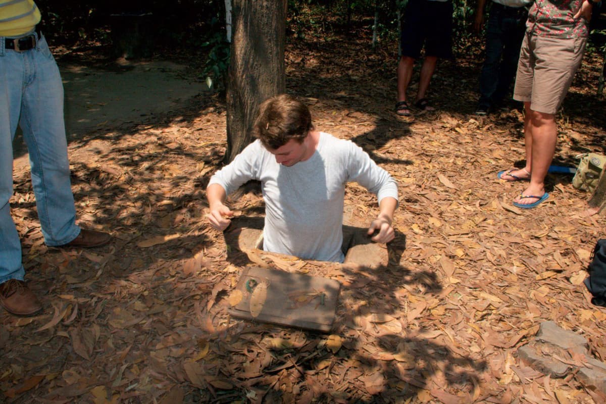 What to Do in Vietnam: Top 10 Must-Dos 10 Visitors in the Cu Chi Tunnels crawl through narrow paths, reliving Vietnam’s wartime past.