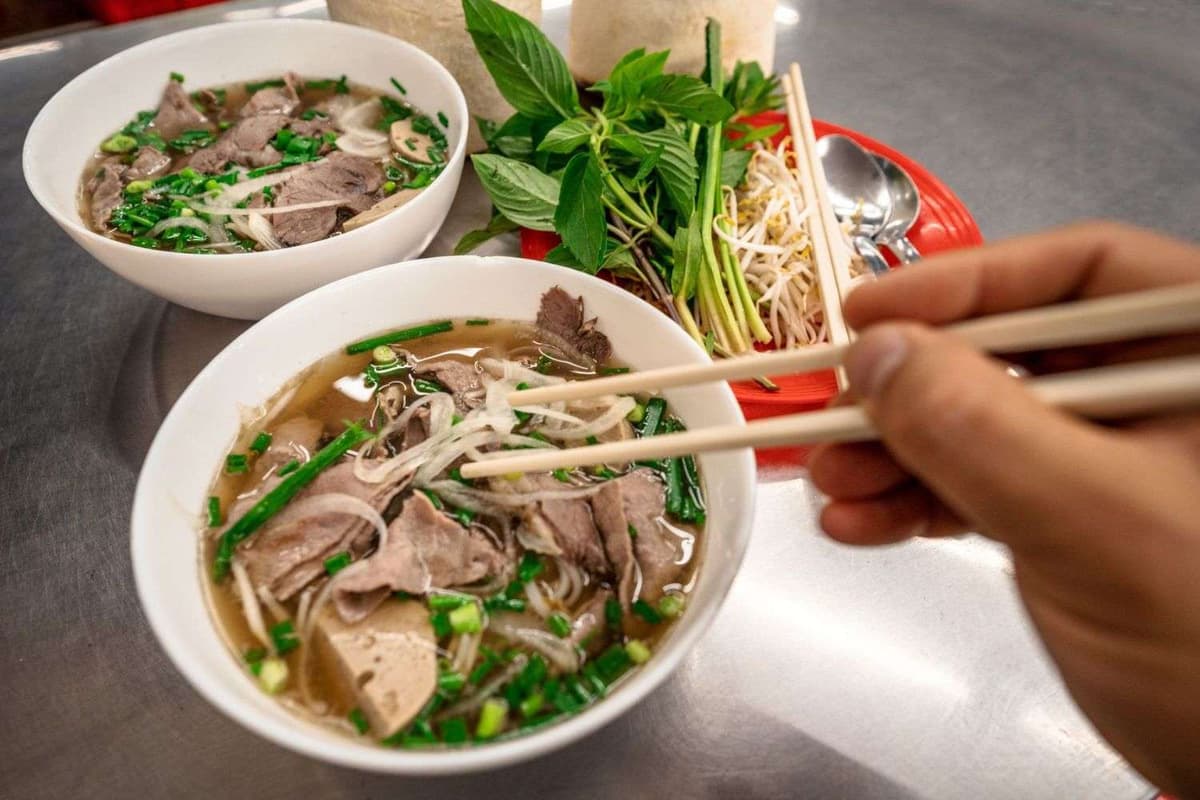 Vietnamese Pho and famous restaurants for travelers 3 The way pho is enjoyed in the Southern Vietnam is more diverse, with various toppings, herbs, bean sprouts, and even pho sauce