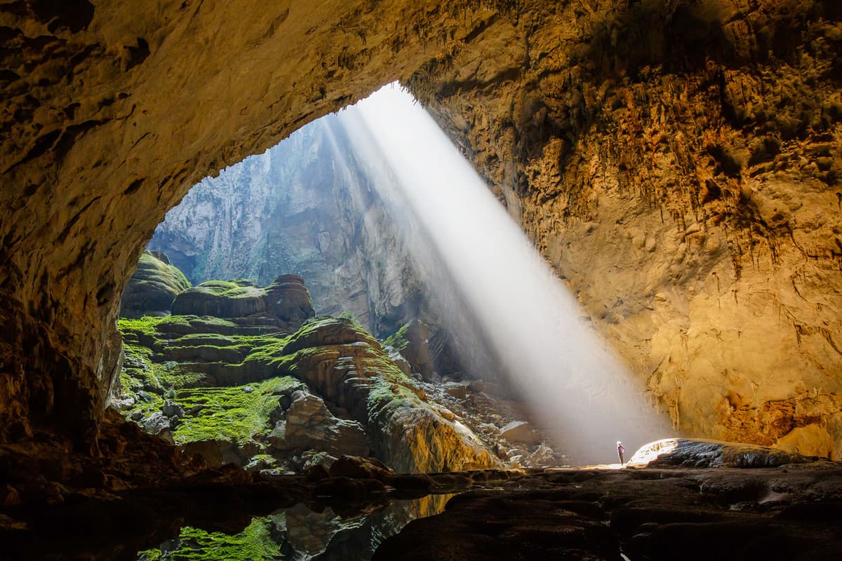 Sunbeam pours through Doline 1, creating one of Son Doong Cave's most breathtaking spectacles